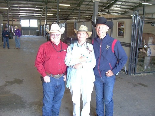 Reiner Tim McQuay on the left, Louisville.com Equestrian Beat Writer Sandy Dolan middle, and singer Lyle Lovett on the right discuss reining in the Alltech Arena stables.