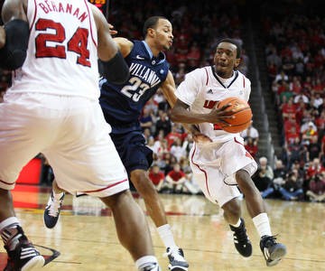 Louisville&#039;s Russ Smith drives past Dominic Cheek as the Louisville men&#039;s basketball team took on Villanova at the KFC Yum! Center Wednesday January 25, 2012. Louisville won the game 84-74. Photo by Jeff Sainlar