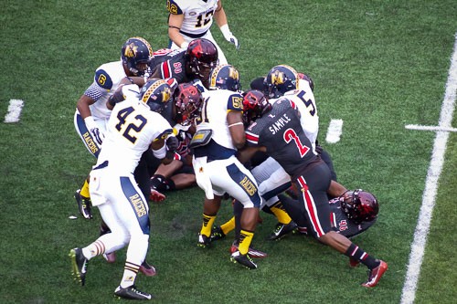 James Sample in on the tackle of Murray State&#039;s Pokey Harris.
