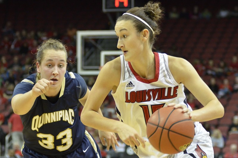 Louisville Guard Megan Deines (15) rushes past Quinnipiac Forward Nikoline Ostergaard (33)