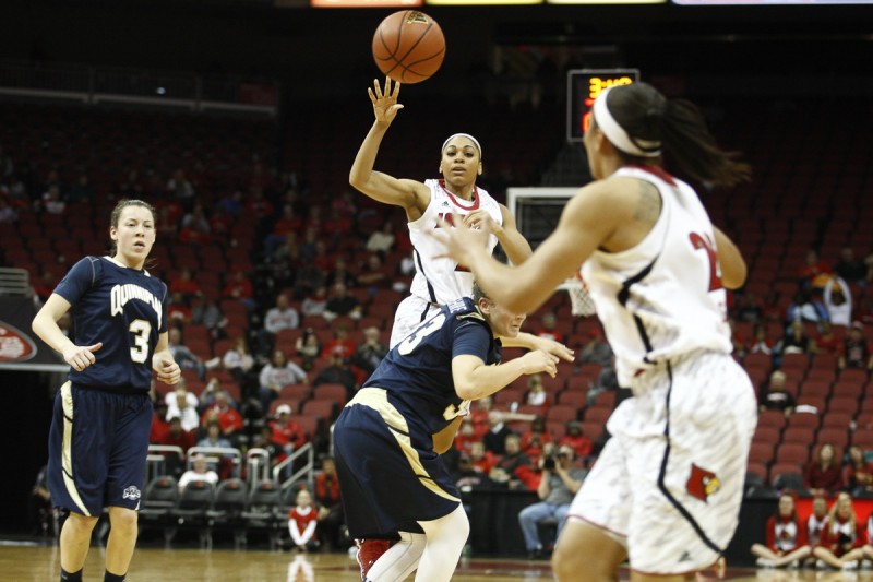 Louisville&#039;s Bria Smith passes the ball to Tia Gibbs in the second half against Quinnipiac