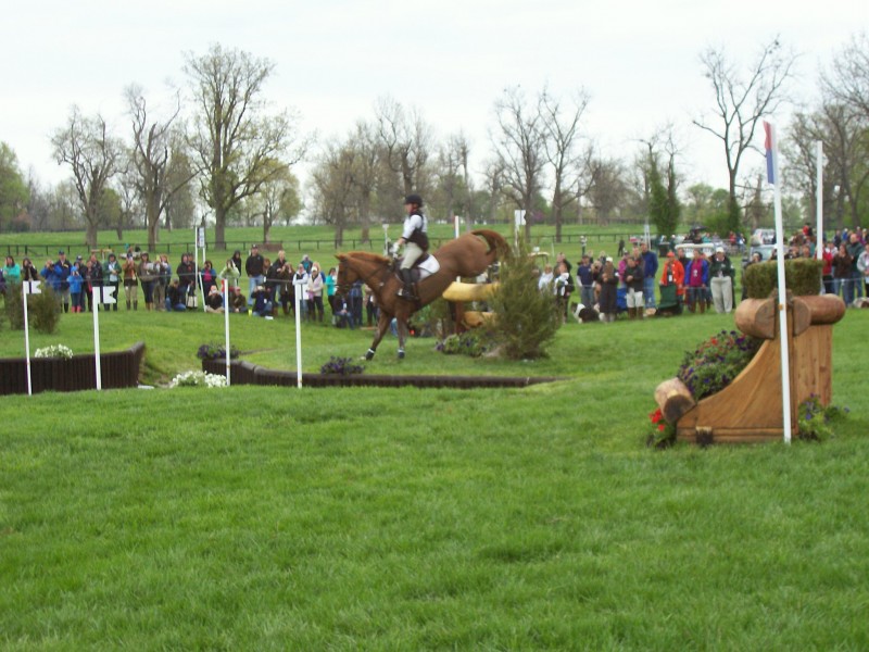 A competitor tackles the Sunken Road obstacle.