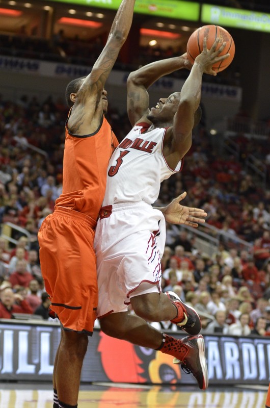 Louisville Guard Chris Jones (3) goes up for a layup in the second half of the game last night. Jones, who is new to the Cards this year, was the Junior College Player of the Year last season.
