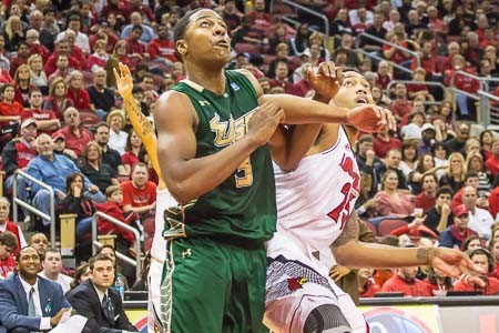Two freshmen named Zach, LeDay for USF and Price for UofL, try to box out.
