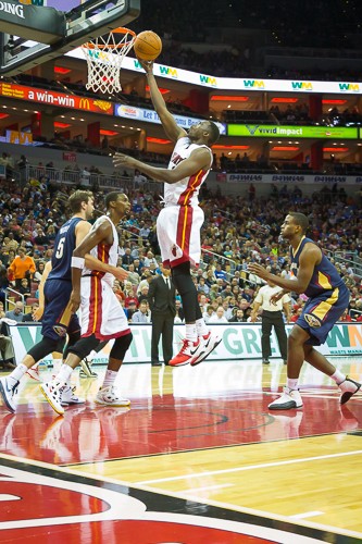 Luol Deng takes it to the basket.