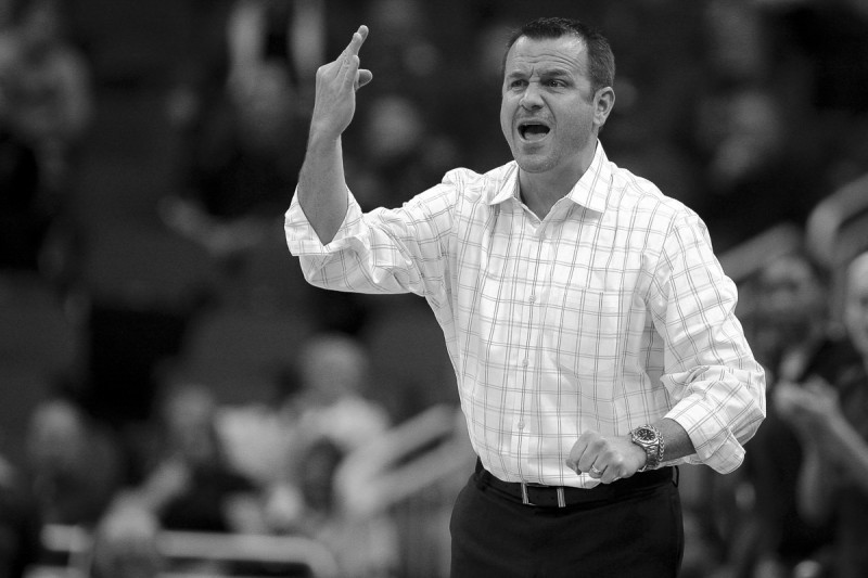 Louisville Coach Jeff Walz signals a play to his team during the game against Quinnipiac