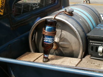 It might be a Bud Light bottle, but this hot rod prefers moonshine.