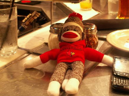 Even this sock monkey is a fan, as well as a good luck charm.