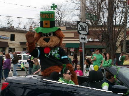 Parkie, mascot of Park Community Credit Union&#039;s youth accounts, waves to the children.