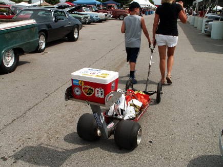 A mother and son drag this wagon down the quarter mile.