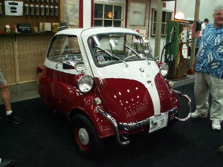 And peruse booths such as this one; the bubble car before you is a BMW Isetta.