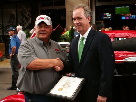 A photo-op with Mayor Fischer and Jerry Kennedy in front of a street rod.