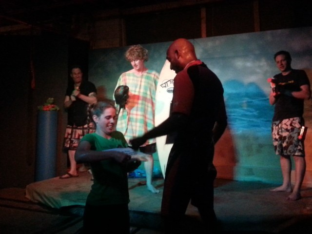 Bodhi (Todd Zeigler) and his surfers (Ben Unwin and Chesley Sommer) make their first appearance