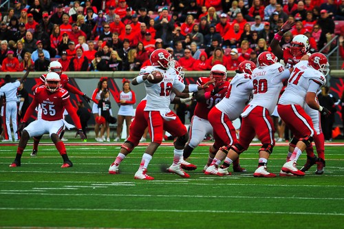 Jacoby Brissett looks for an NC State reciever to throw it to.