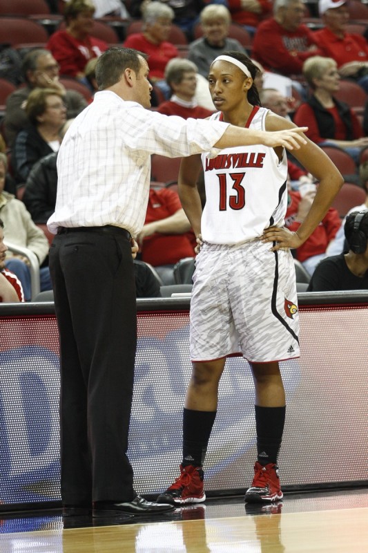 Louisville Forward Cortnee Walton (13) listens to Coach Walz during the second half of the game against Quinnipiac