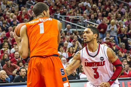 Michael Carter Williams tries to deal with the defense of Peyton Siva.
