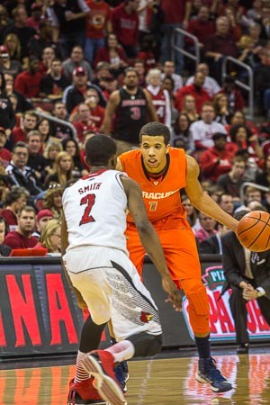 Michael Carter-Williams tries to take Russ Smith one on one.