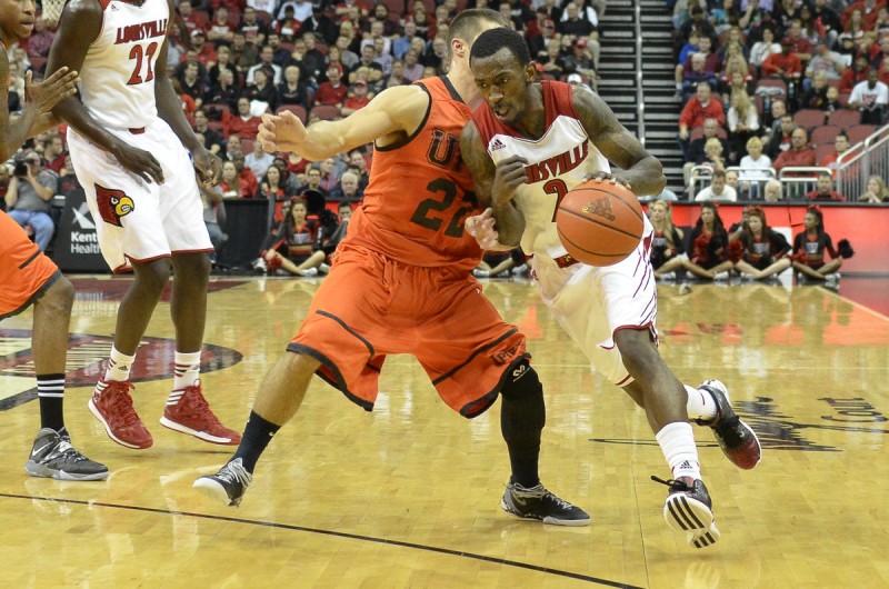 Senior Guard Russ Smith (2) rushes past Pikeville Guard Elisha Justice (22). Justice played for the Cards as a walk on two years ago, before transferring to Pikeville.