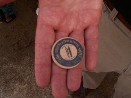On the other side of the coin, the Seal of the Commonwealth of Kentucky.