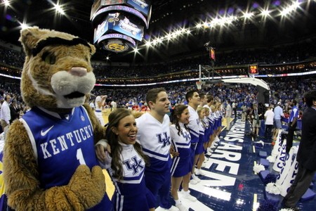 The Cat and cheerleaders leading the crowd in singing &#039;My Old Kentucky Home&#039;.