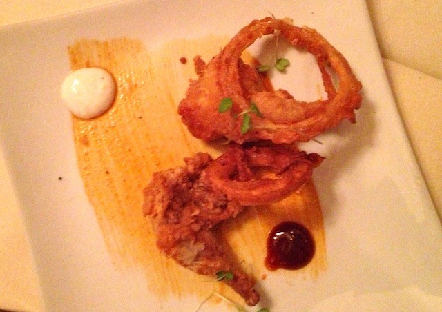 Crispy Fried Chipotle BBQ Quail Legs Served with Beer Battered Onion Rings With a Horseradish Cream Sauce
