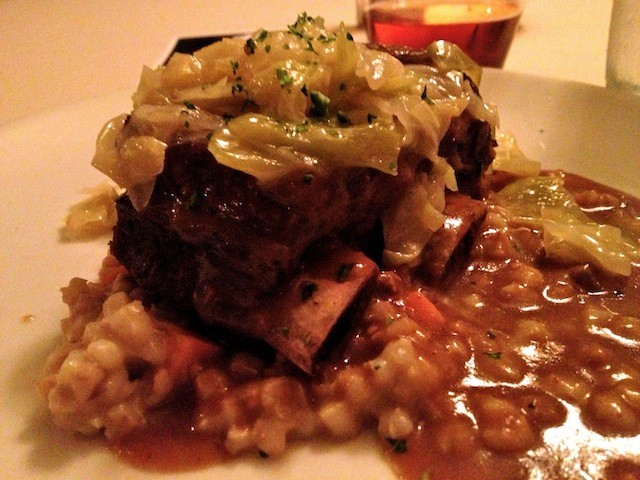 Beer Braised Short Ribs and House-Made Sausage Served with Toasted Barley and Carrot Risotto, Buttered Cabbage and Caraway Finished with a Porter Beer Sauce