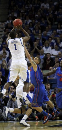 Darius Miller shoots the three.