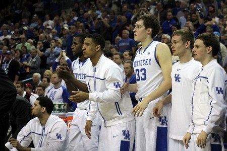 As the bench cheers the Cats on.