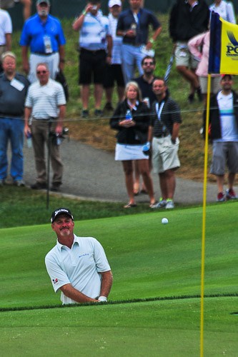 Jerry Kelley shoots out of trap on 18 second round of the 2014 PGA Championship golf tournament at Valhalla Golf Club.
