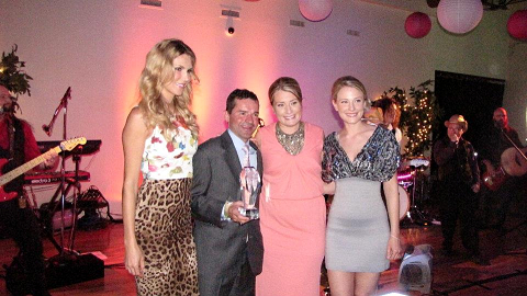 Kent DesOrmeaux receiving his Ferdinand&#039;s Award poses with Host Brandi Granville, and Event Founders Kim Boyle and Aimee Wulfeck.