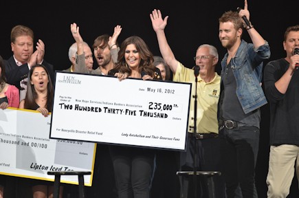 Lady Antebellum presenting their check for $235,000