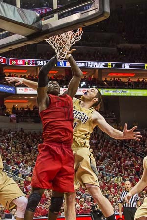 Gorgui Dieng challenged by Cameron Biedschied.