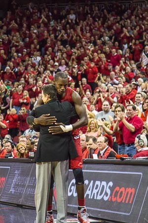 Coach Rick Pitino hugs Gorgui Dieng while Card Nation gives a standing ovation.