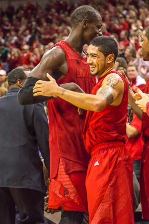 Gorgui Dieng and Peyton Siva hug after their last home game as Cardinals.