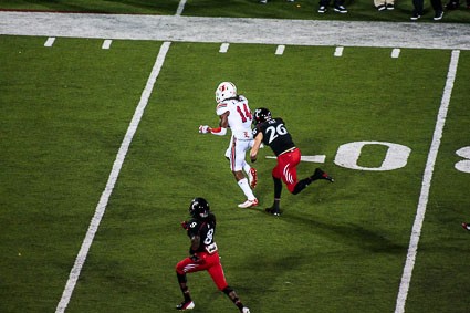 Louisville&#039;s Andrell Smith being chased by Drew Frey.