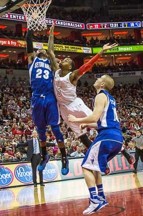 Kevin Ware goes to the basket against Fuquan Edwin (23). Even though Ware was the shooter, he was called for the foul.