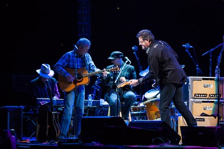 Multi-instrumentalist Vince Gill interacts with the audience and the band.jpg