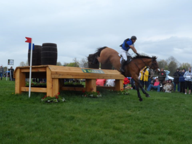 American Buck Davidson jumps Ballynoe Castle RM over the Tobacco Stripping Bench obstacle.