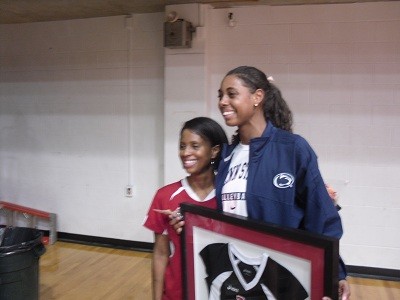 Deja with her mother, Suzanne, and her framed jersey.