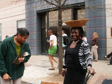 Elizabeth Kizito of Kizito selling her famous cookies from her little red wagon.
