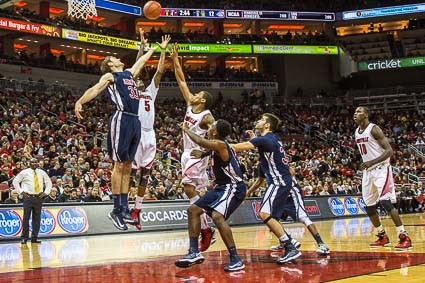 Samford&#039;s Levi Barnes fights Russ Smith for a rebound.