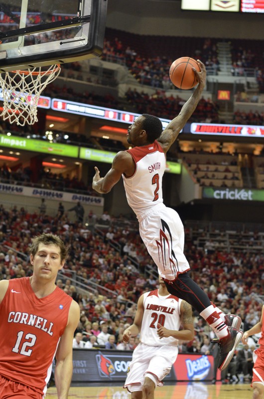 Russ Smith goes up for a dunk in the first minutes of the game