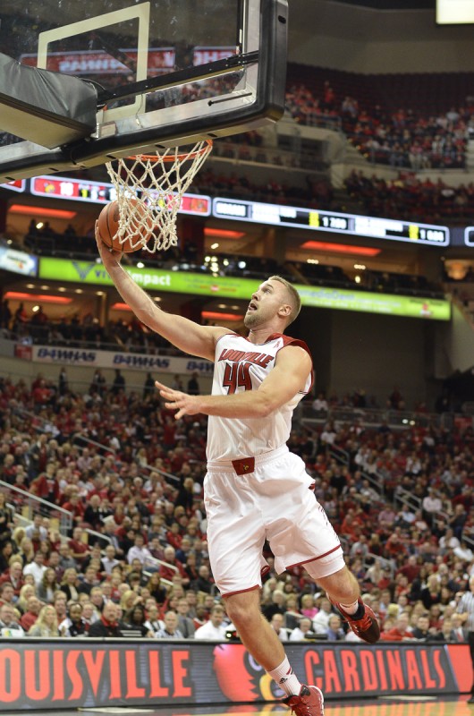Louisville Center Stephen Van Treese goes up for a layup in the first half of the game against Cornell