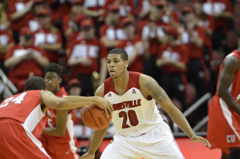 Louisville Forward Wayne Blackshear defends against Cornell