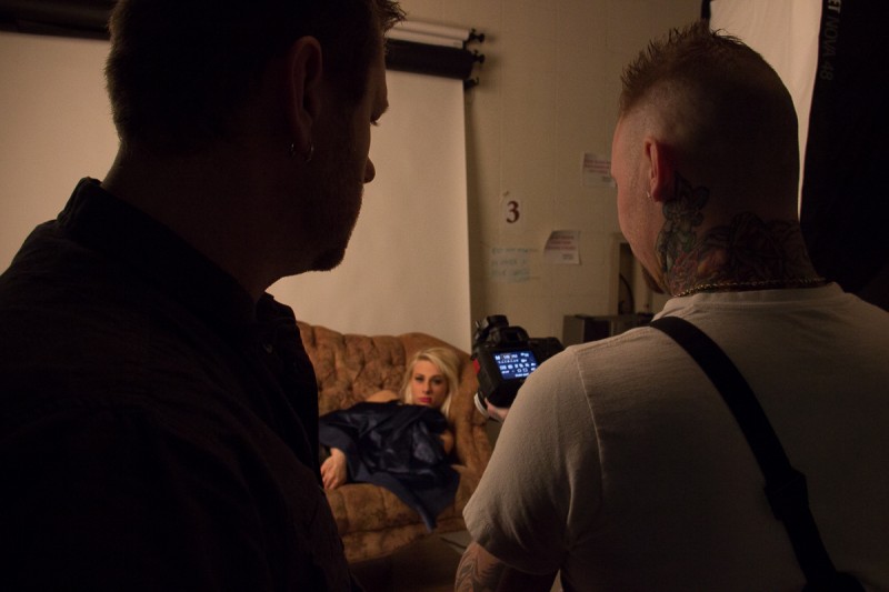 Hibben and Lightman look at photo of Kayla Goss - photo by Josh Tyson