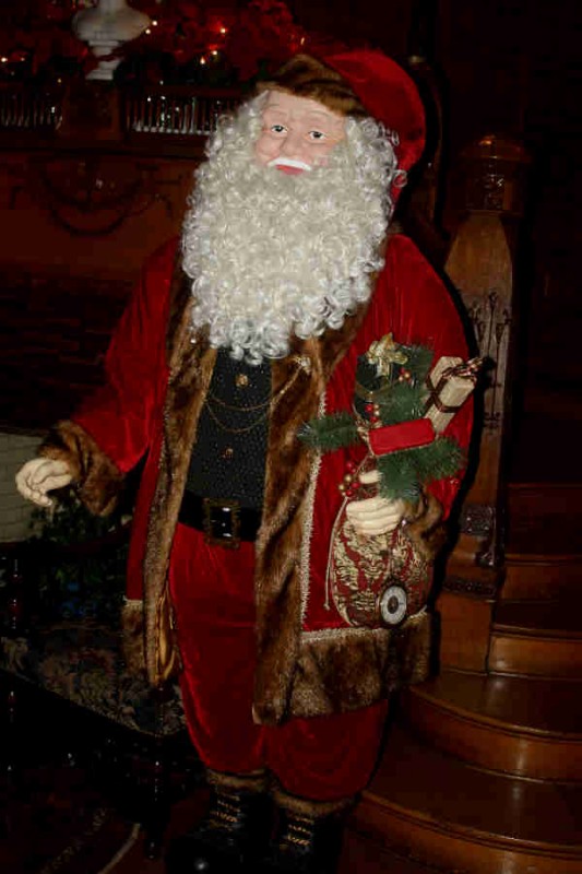 A classic Santa greets guests upon arrival to the mansion