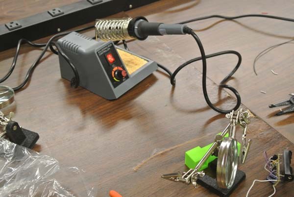 Soldering irons are one of the instruments the children learn to use.